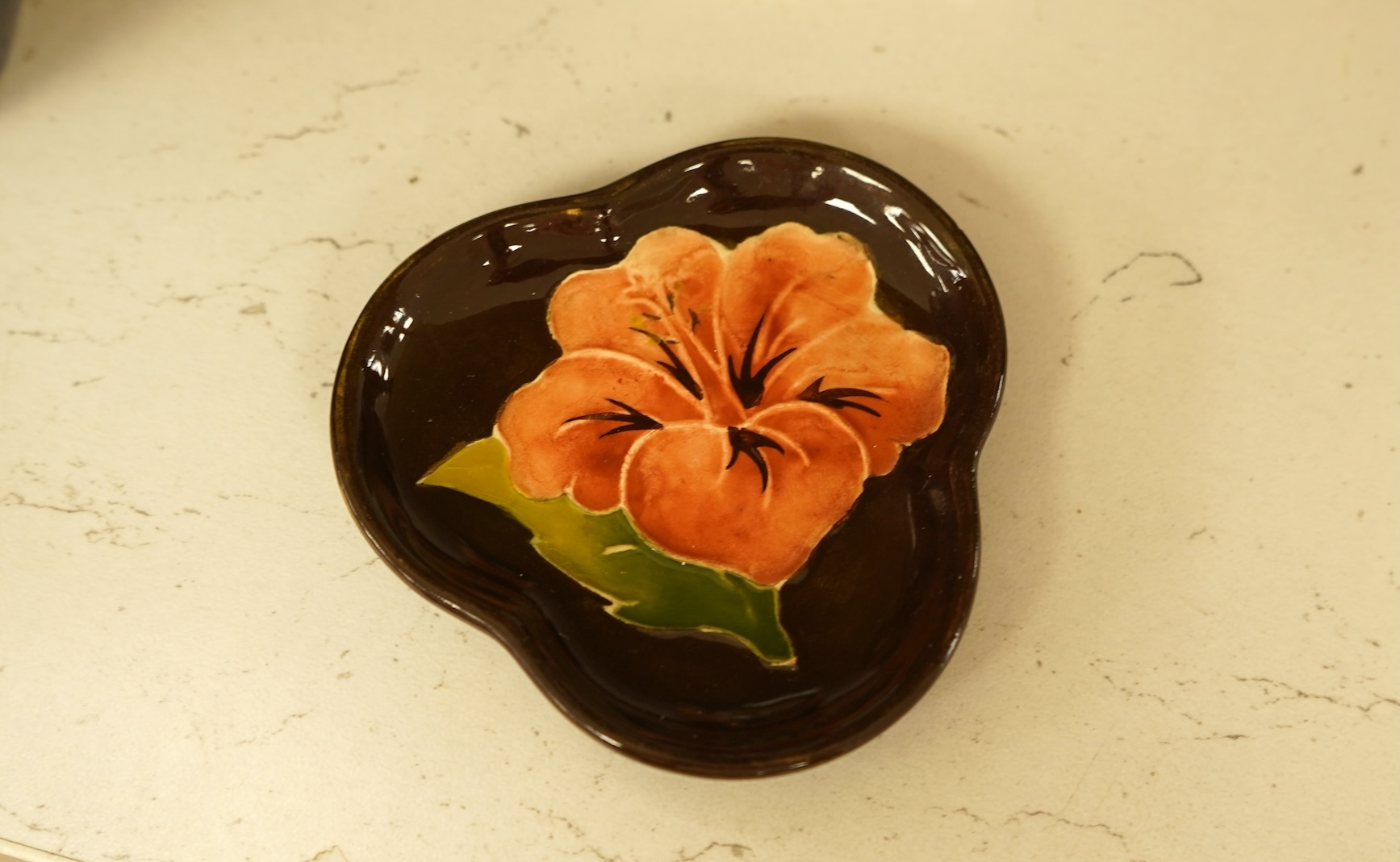 A collection of nine modern Moorcroft pieces including a Furzy Hill vase and a Toadstool vase, tallest 19cm